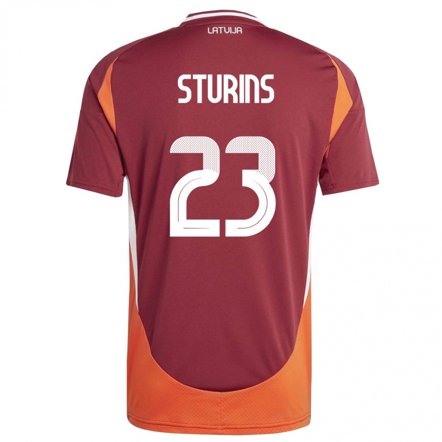 נשים כדורגל לטביה Raivo Sturins #23 אדום עמוק לבן כתום ג'רזי ביתית 26-28